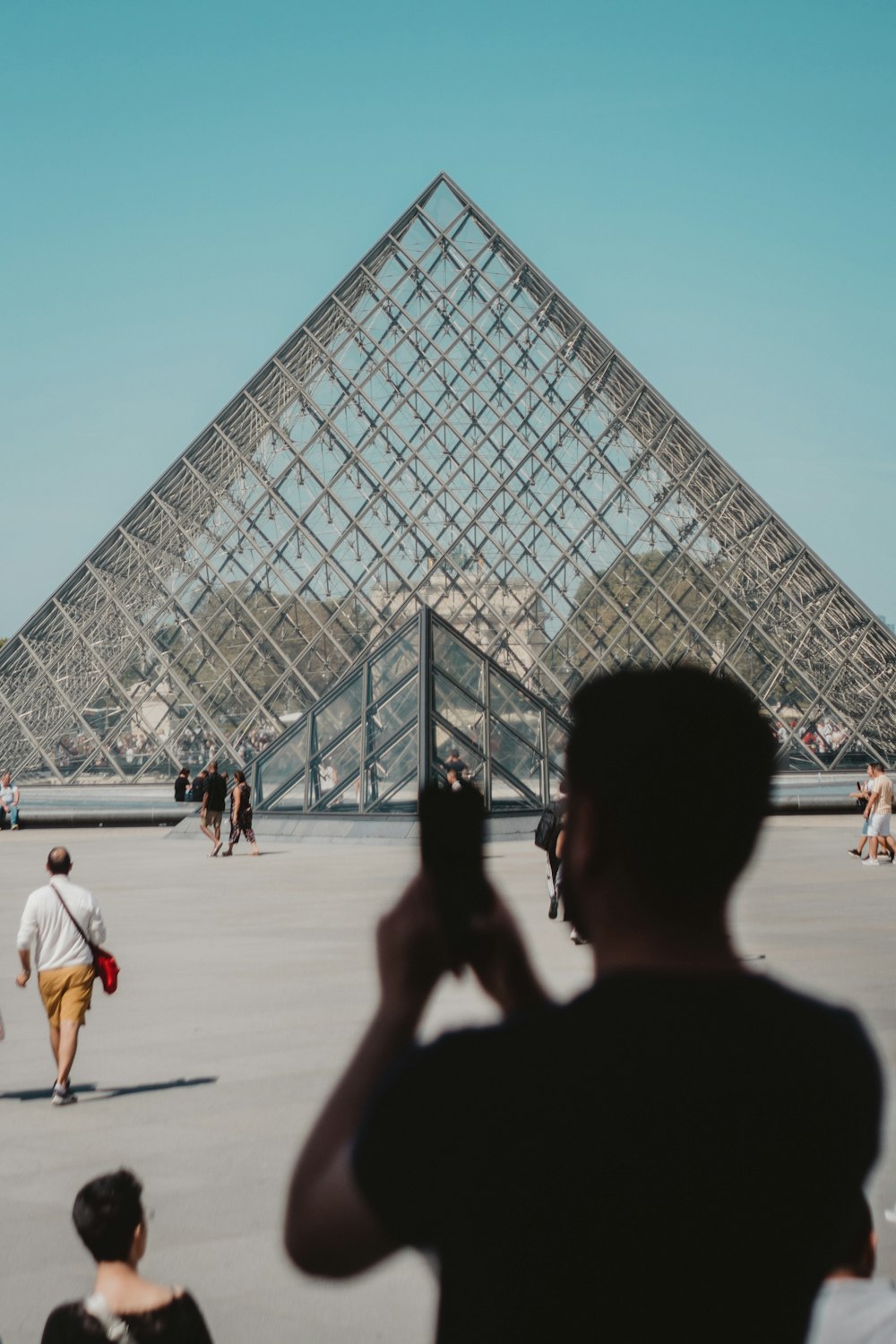 people near triangular structure