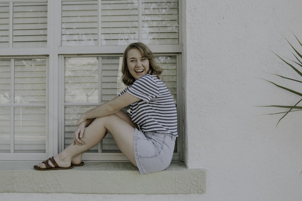 woman wears white and black striped t-shirt