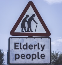 elderly people crossing road sign