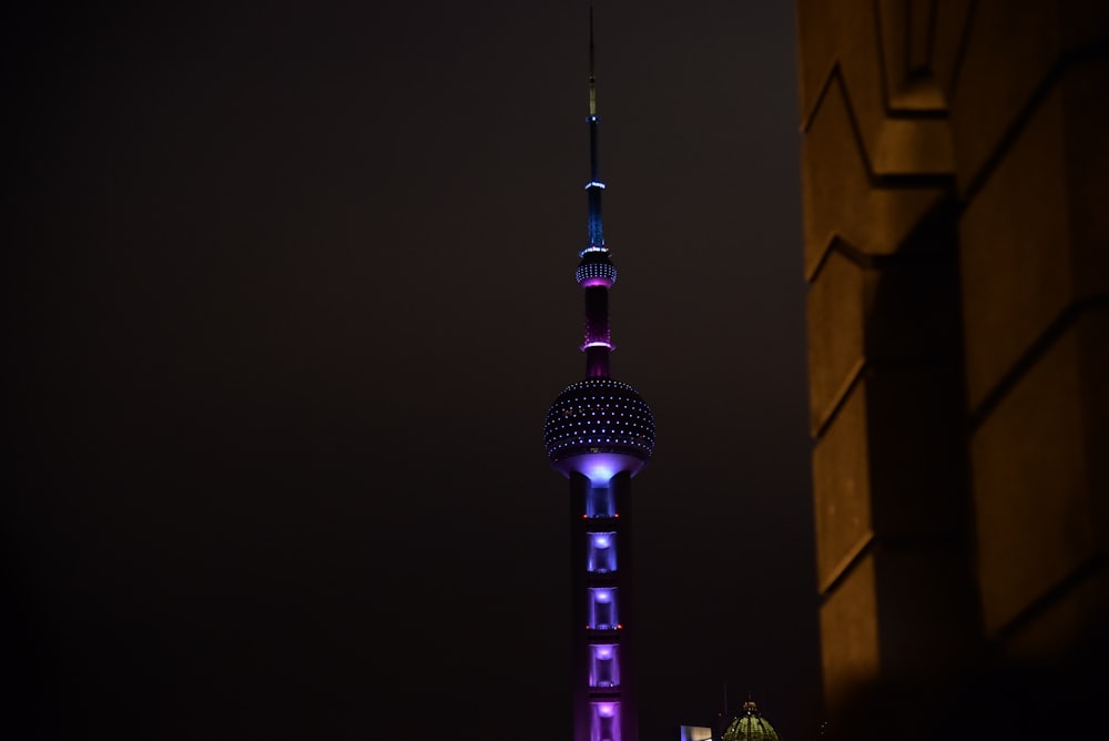 low-angle photo of tower during night time