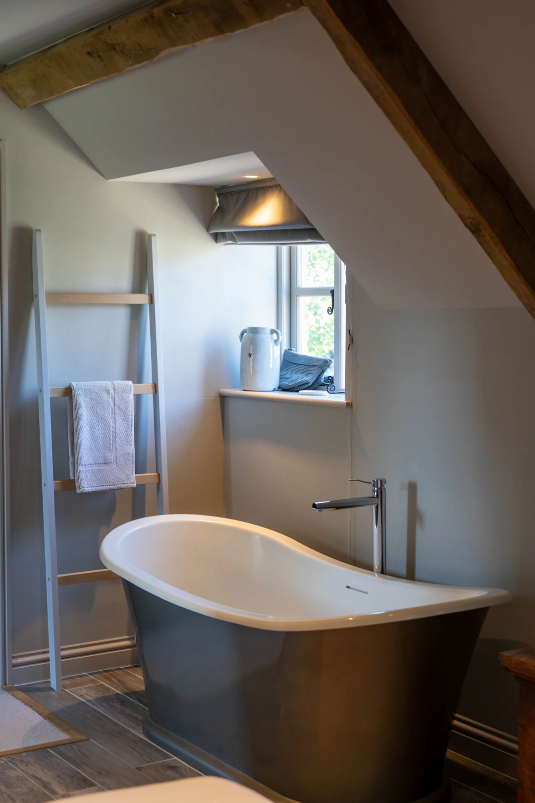 The freestanding bath beneath the eaves
