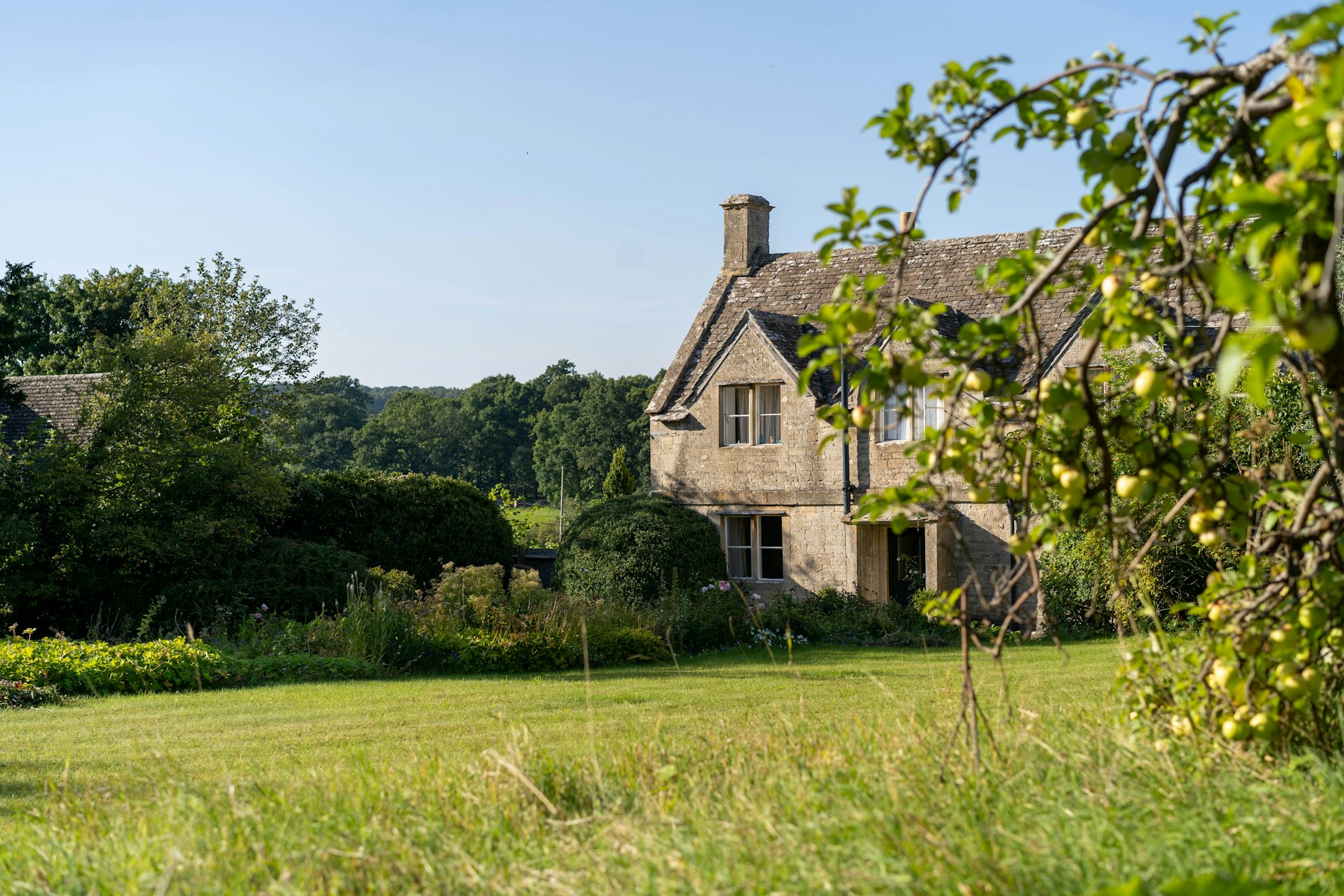 An estate seen across open ground at first light