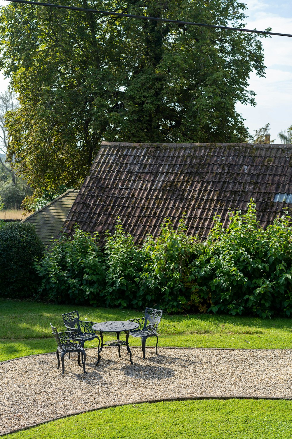 table and chairs near house