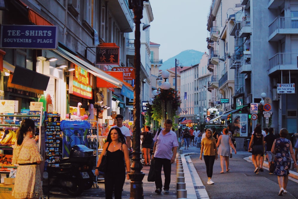 people on road near buildings