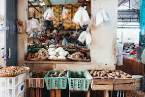 A vibrant halal food market stall with fresh fruits and spices in Da Nang.
