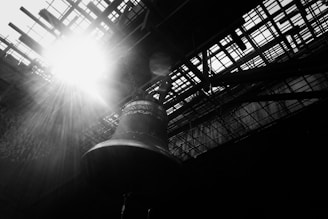 Close-up of the Liberty Bell with sunlight casting a golden glow on its iconic crack.