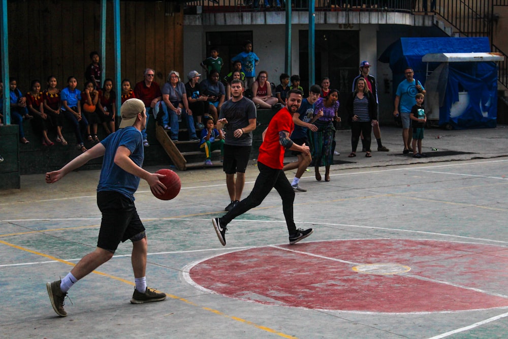 group of men playing basketball