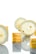 A minimalist composition featuring slices of lemon interspersed with small layered lemon cakes. The bright yellow and white hues create a fresh and vibrant atmosphere. The cakes have a glossy top layer, and the reflection on the surface adds an elegant touch.