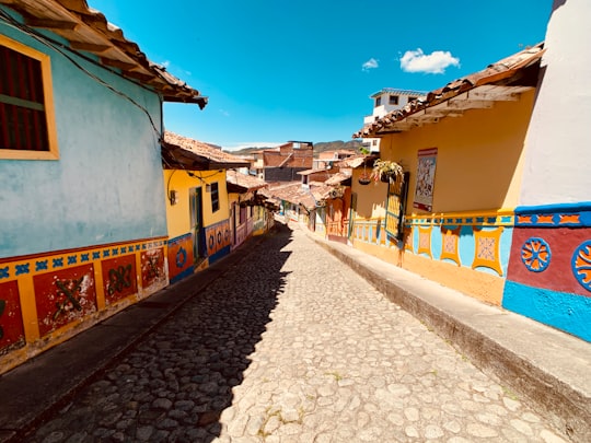 road between houses under blue sky in Guatapé Colombia