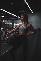 woman standing and holding ball