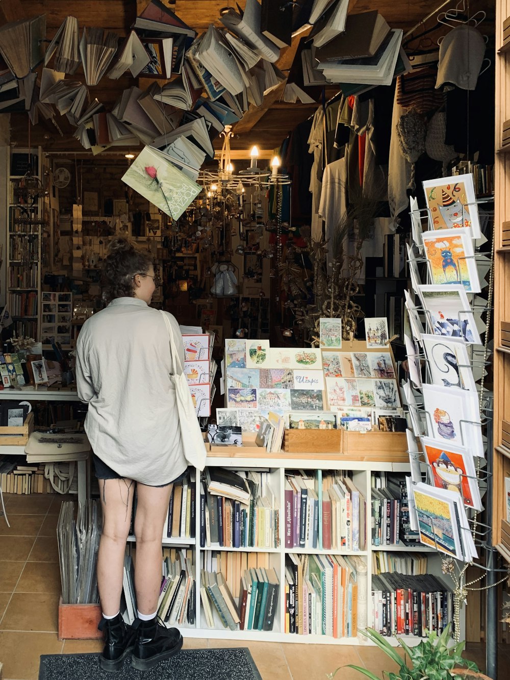 a man standing in front of a book store