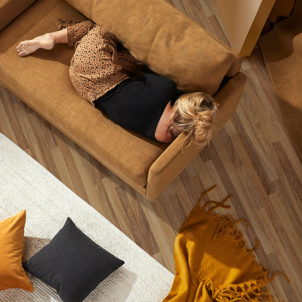 woman lying on sofa