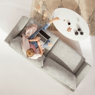 woman sitting on sofa