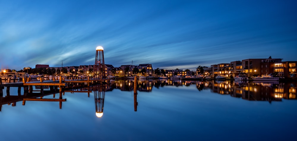 body of water near lighted cityscaope