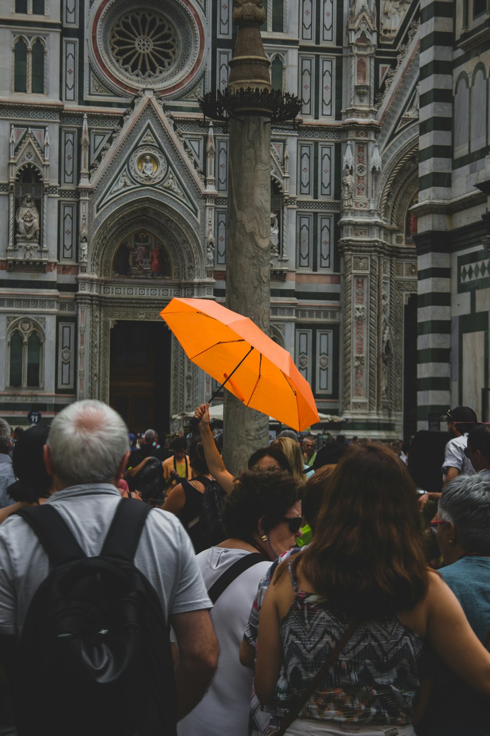 group of people standing near structure