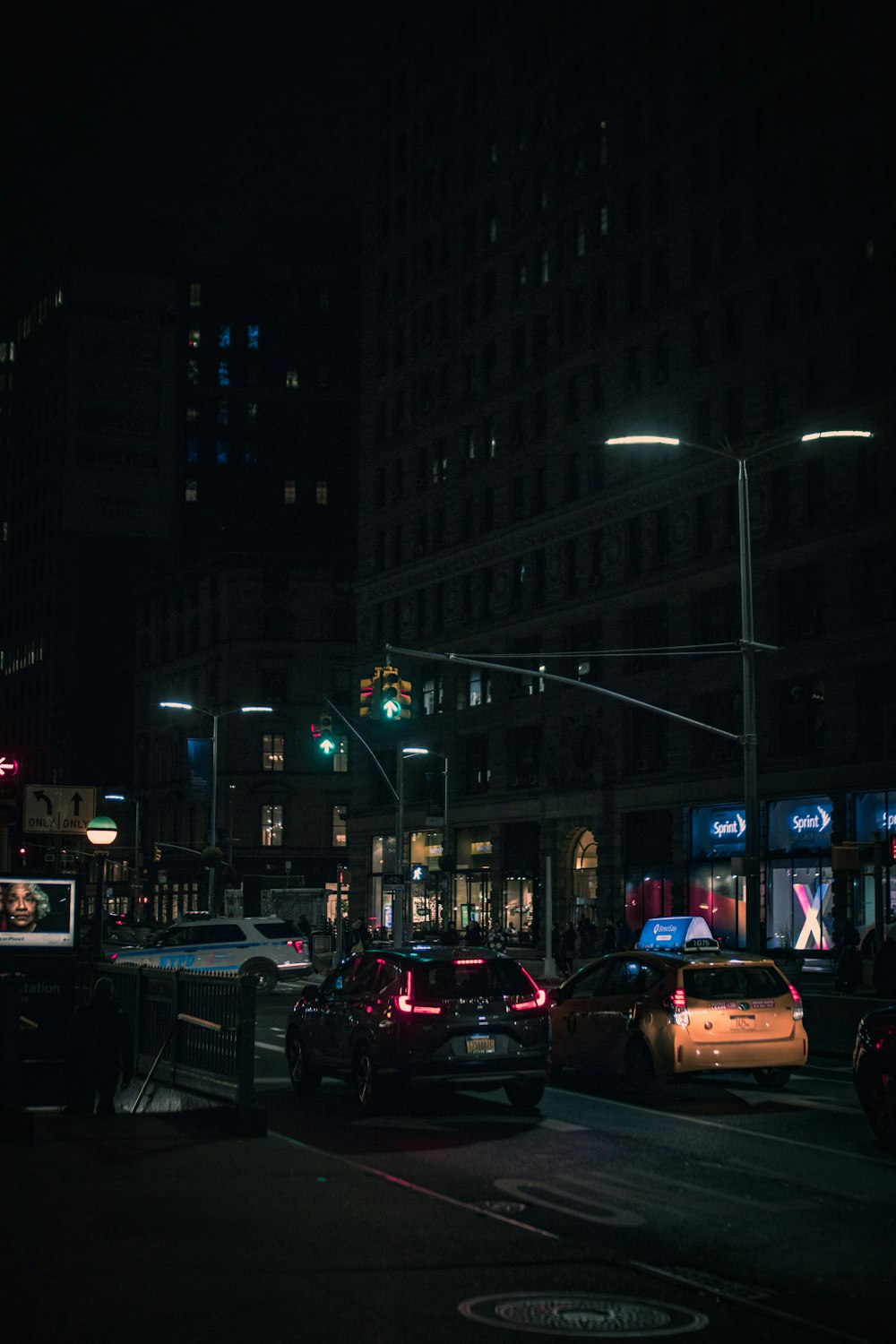 a city street filled with traffic at night