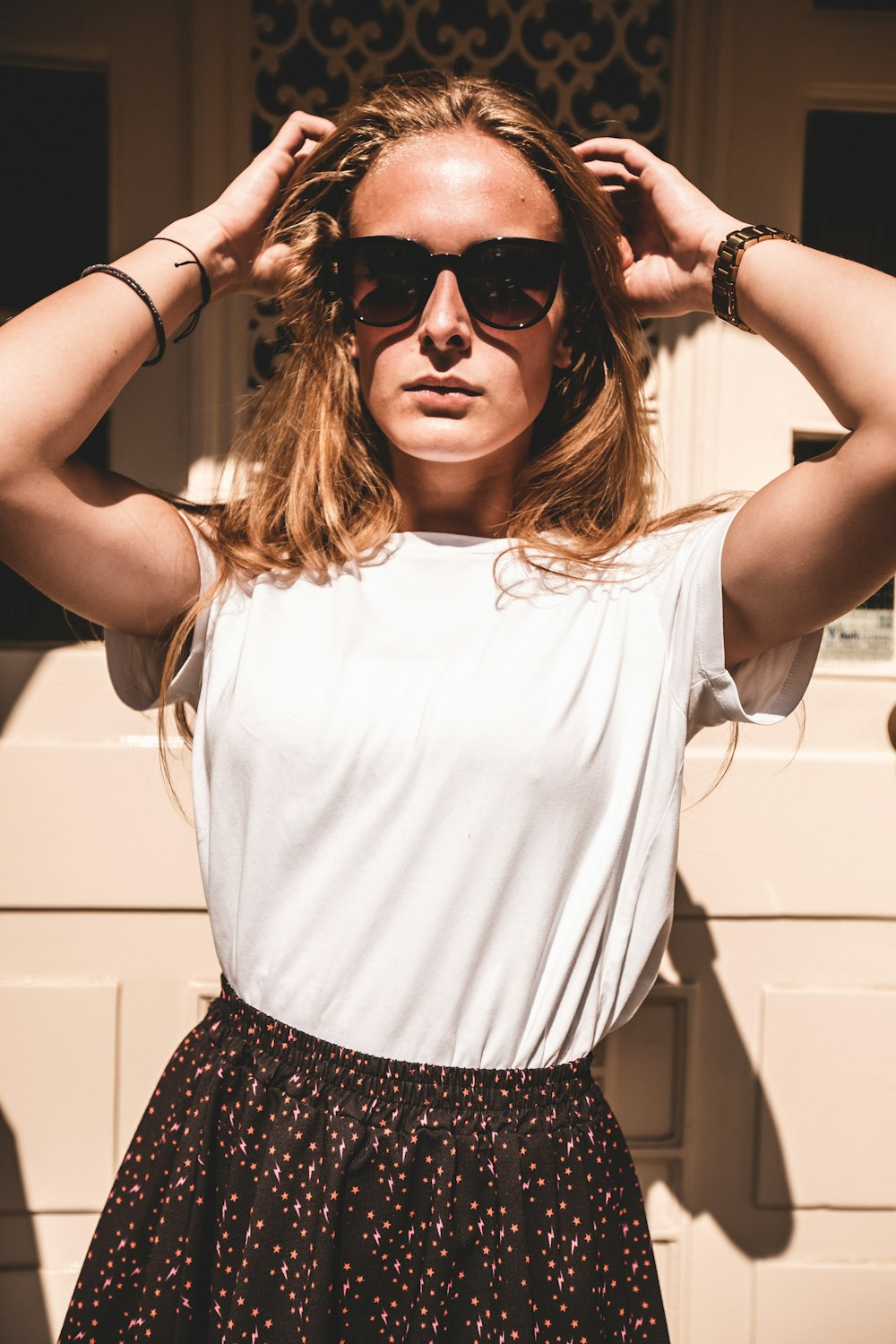 woman standing in front of house