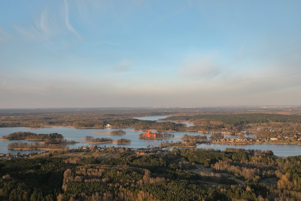 Body of water near mountain at daytime — Trakai, Lithuania