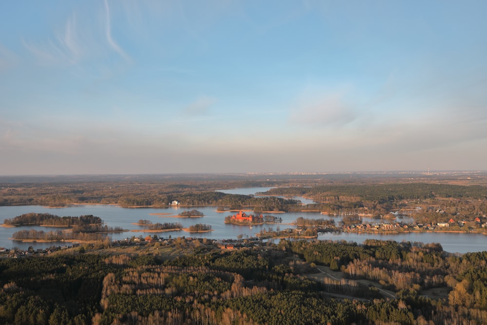 body of water near mountain at daytime