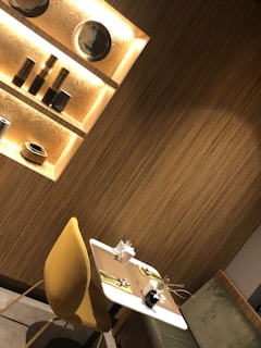 A modern dining table set featuring dark blue and golden yellow ceramic bowls from dinoyostudio.com.