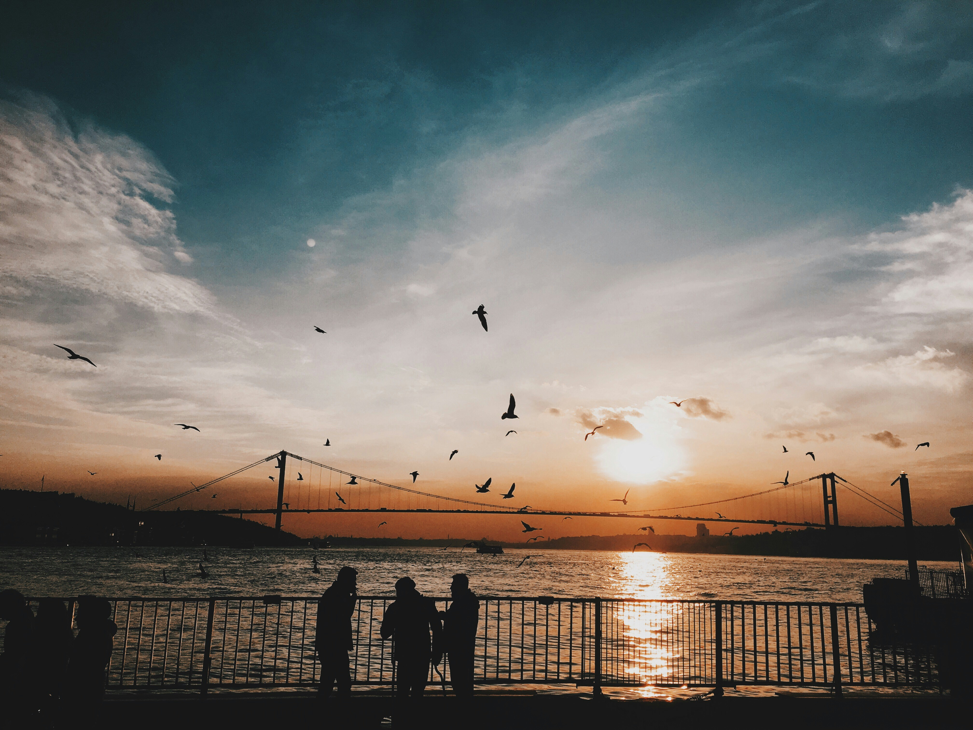 people standing near sea