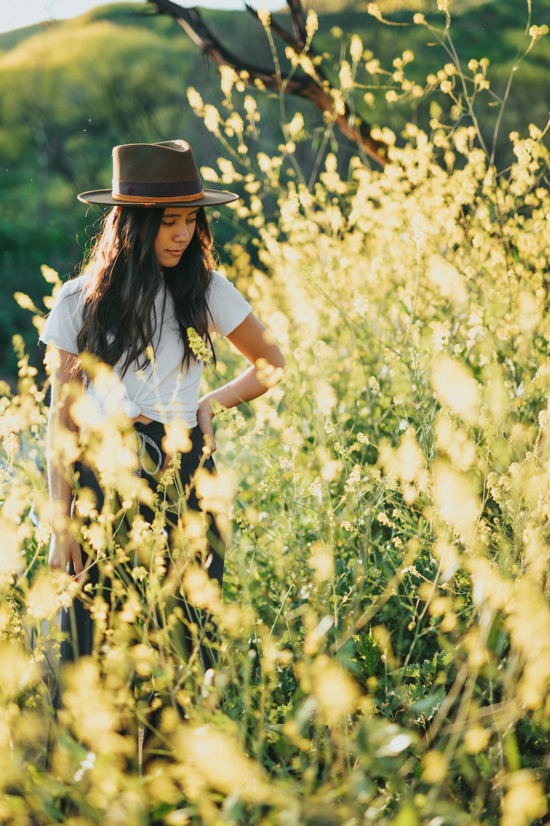 woman wearing white shirt and brown hat