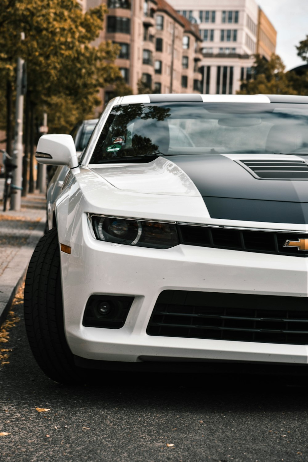 white Chevrolet vehicle on road