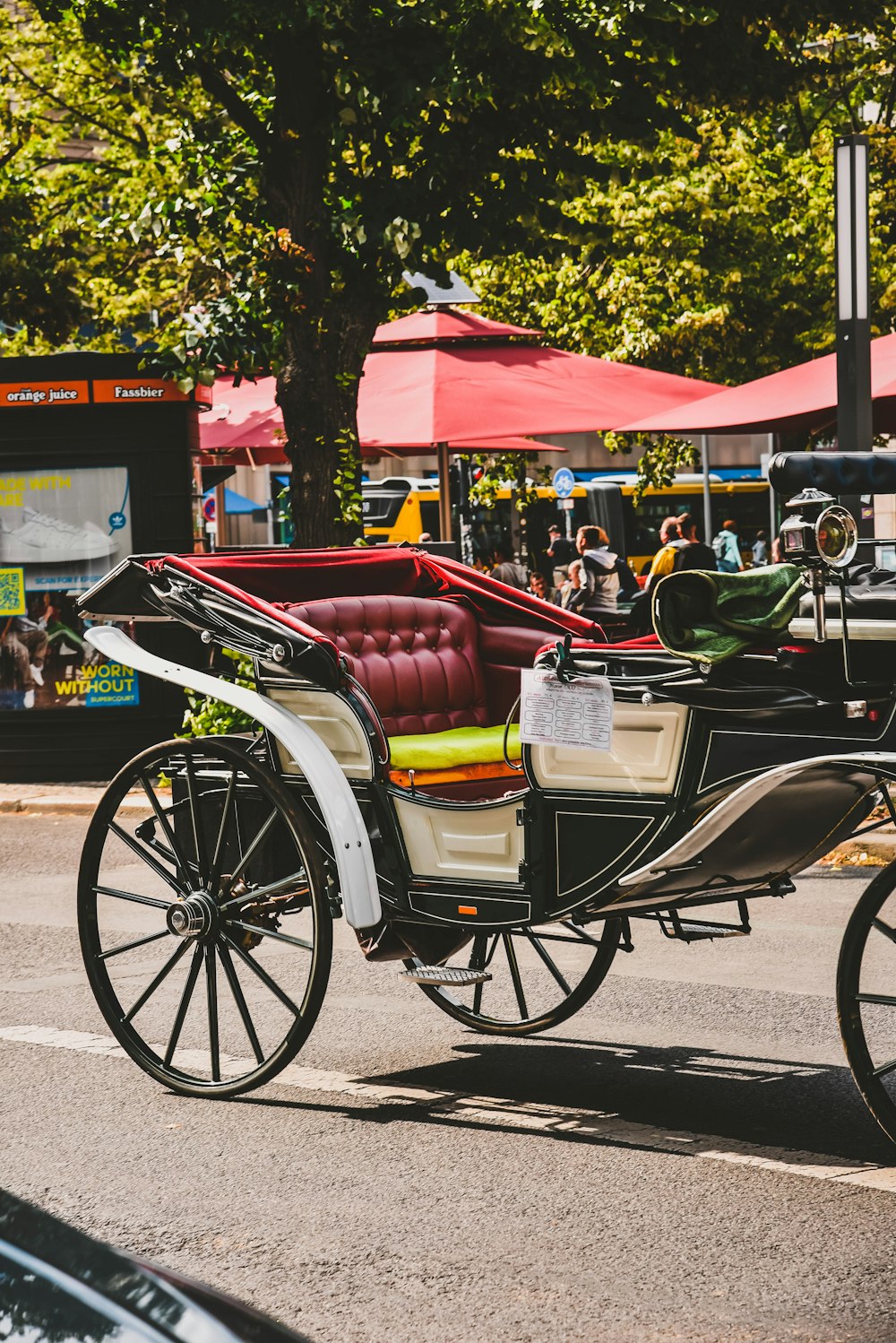 black and maroon carriage on focus photography