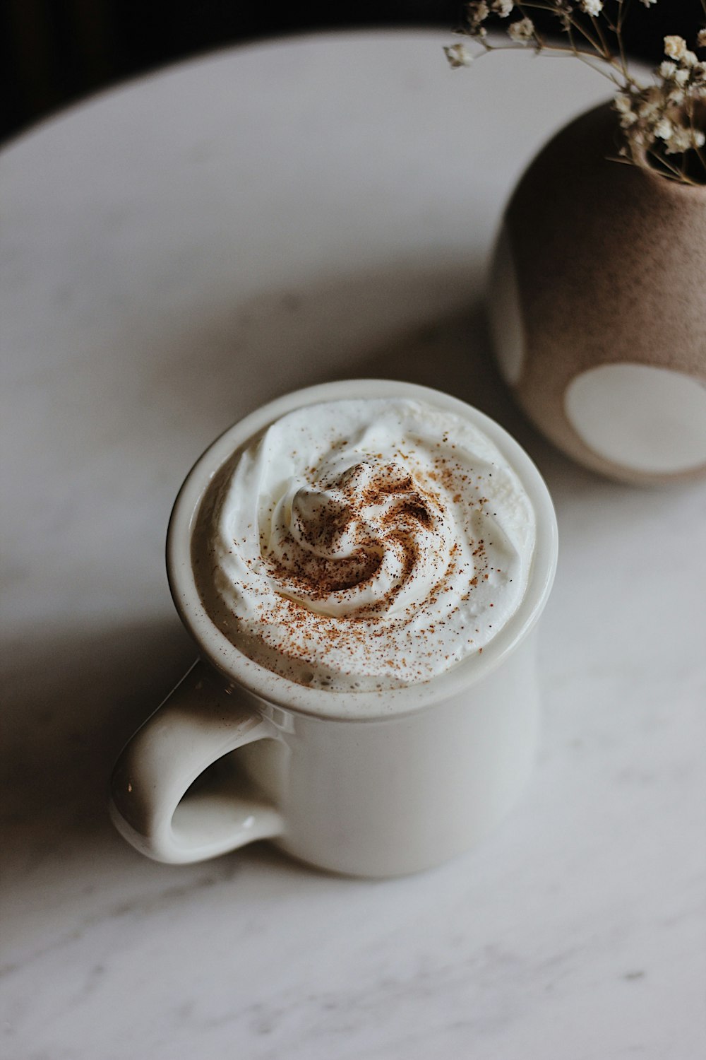 white mug on table