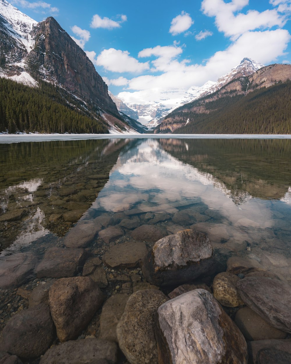 mountain ranges surrounding body of water