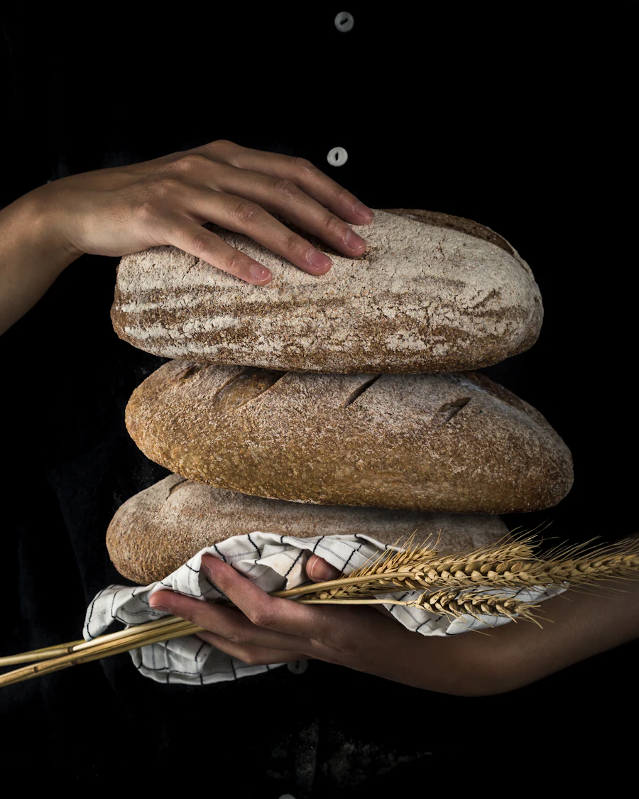 Baker holding freshly baked bread