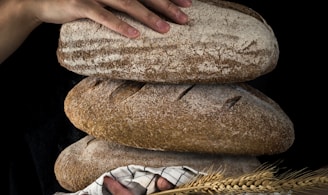 person holding baked bread