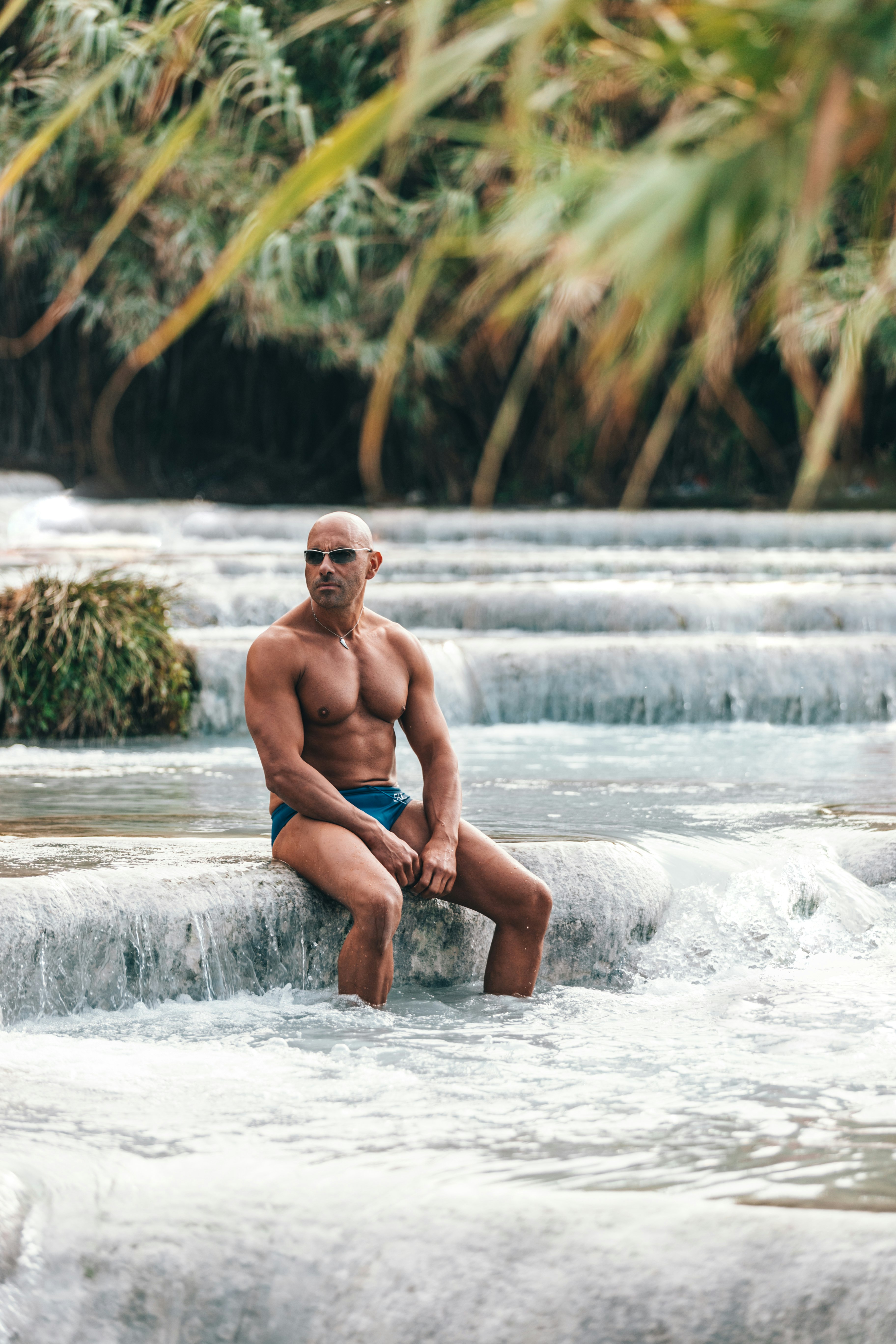 man sitting near trees