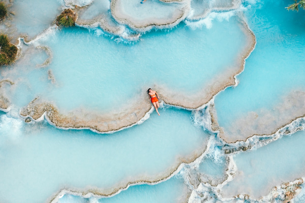 A woman enjoying the warmth of hot springs