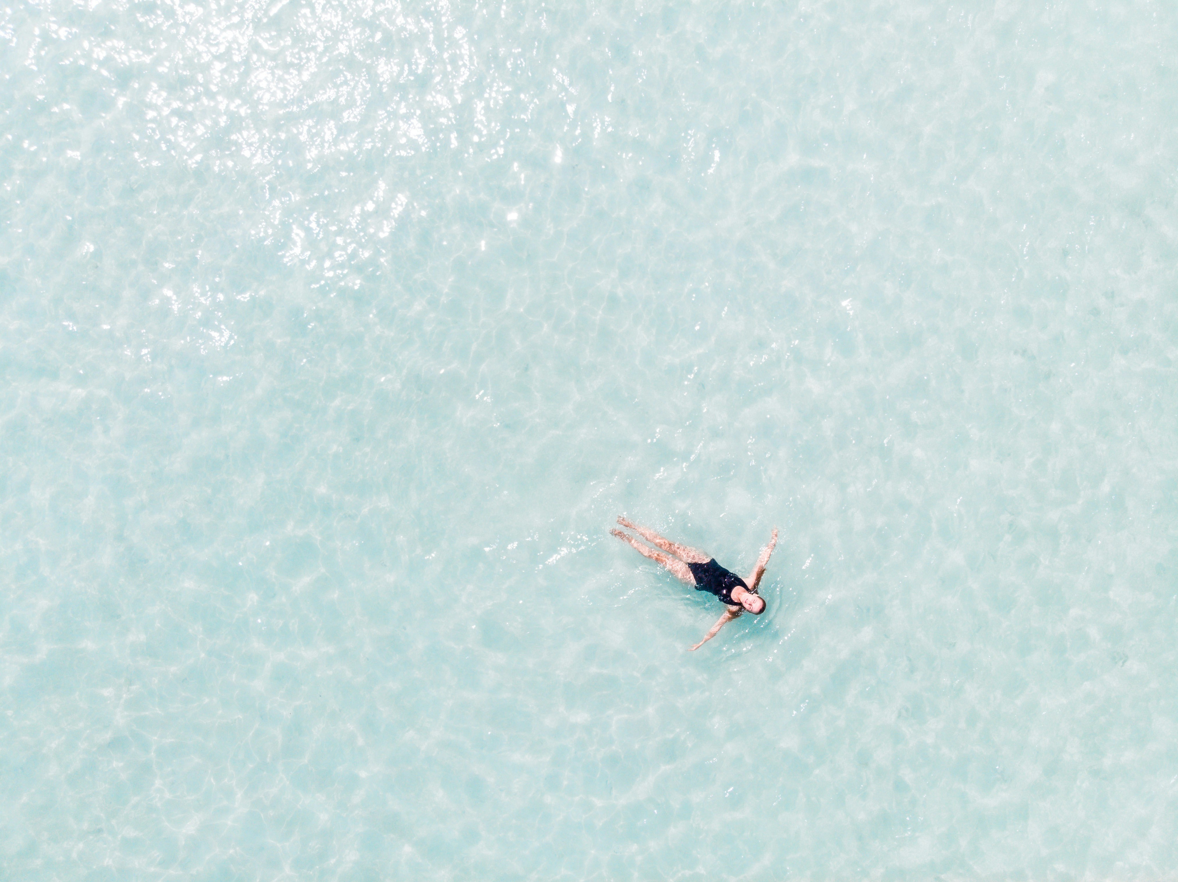 woman floating on the water surface