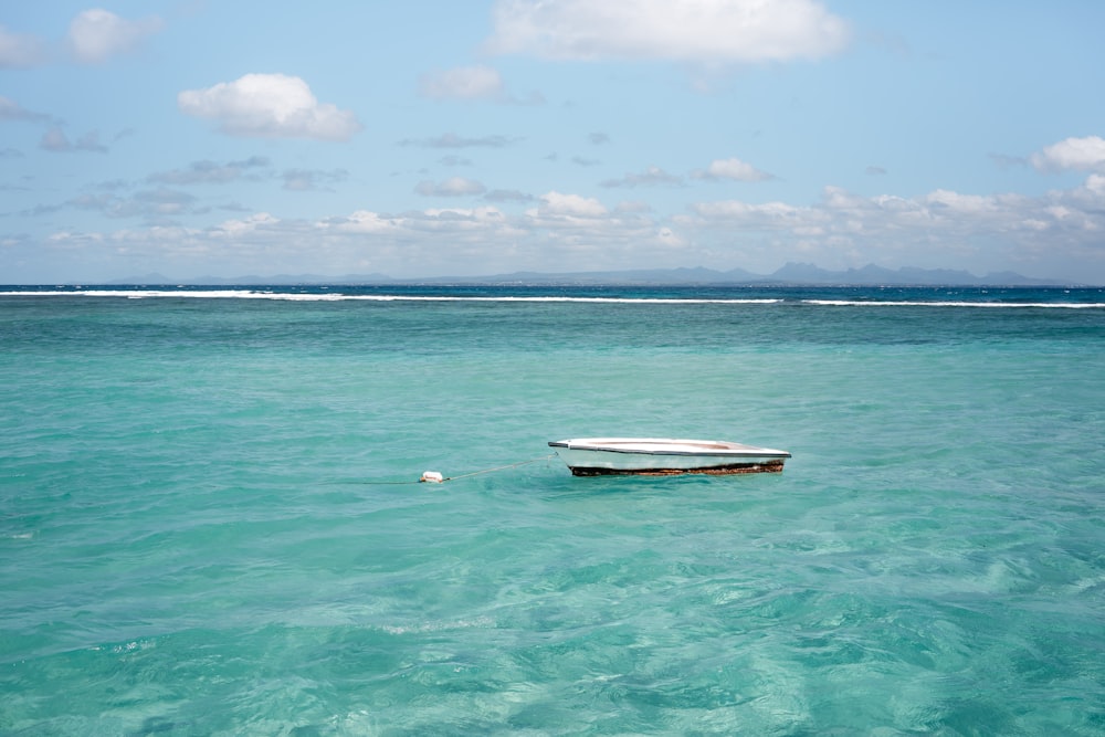 white wooden boat