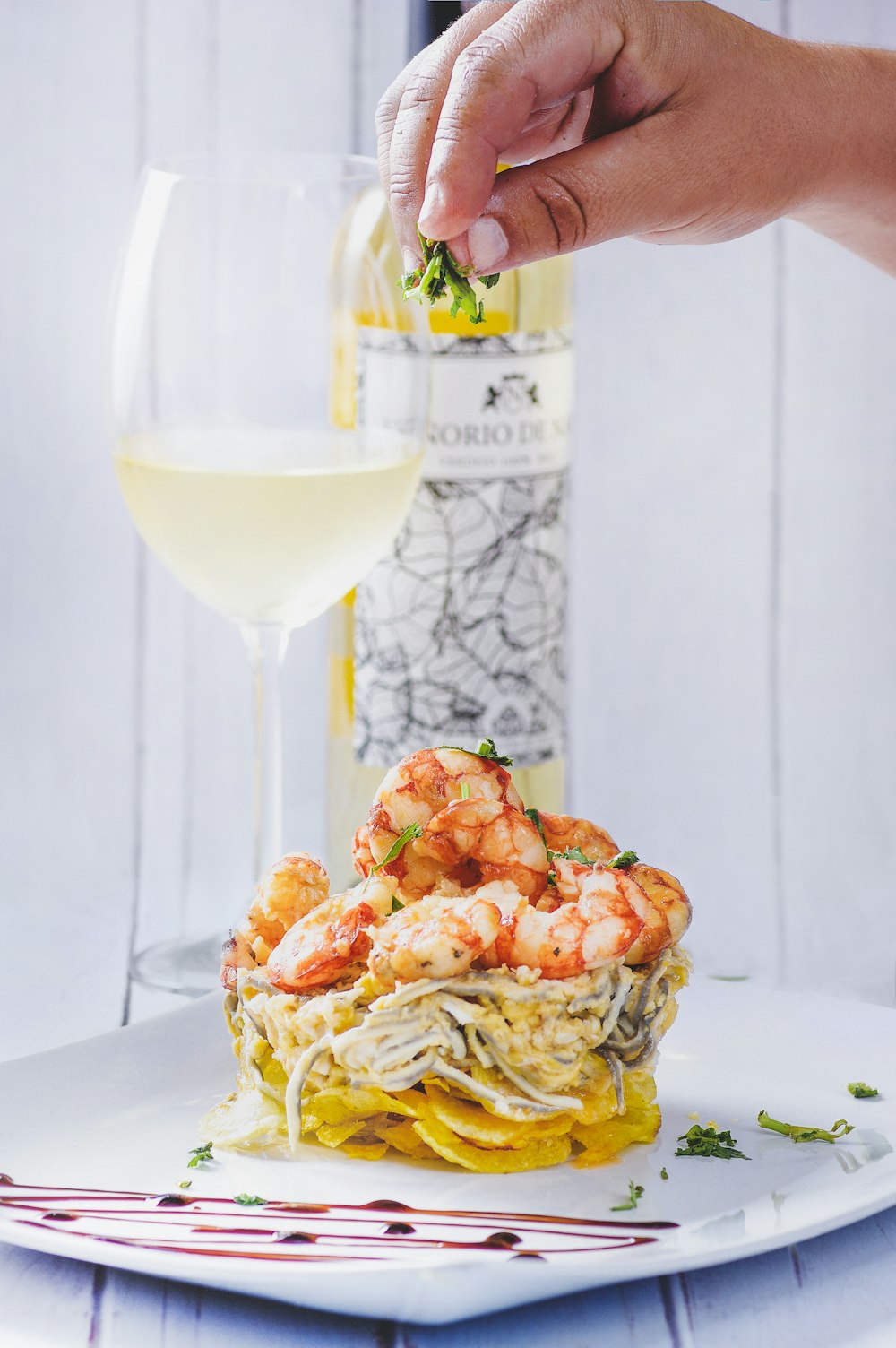 shrimp pasta and half-filled wine glass