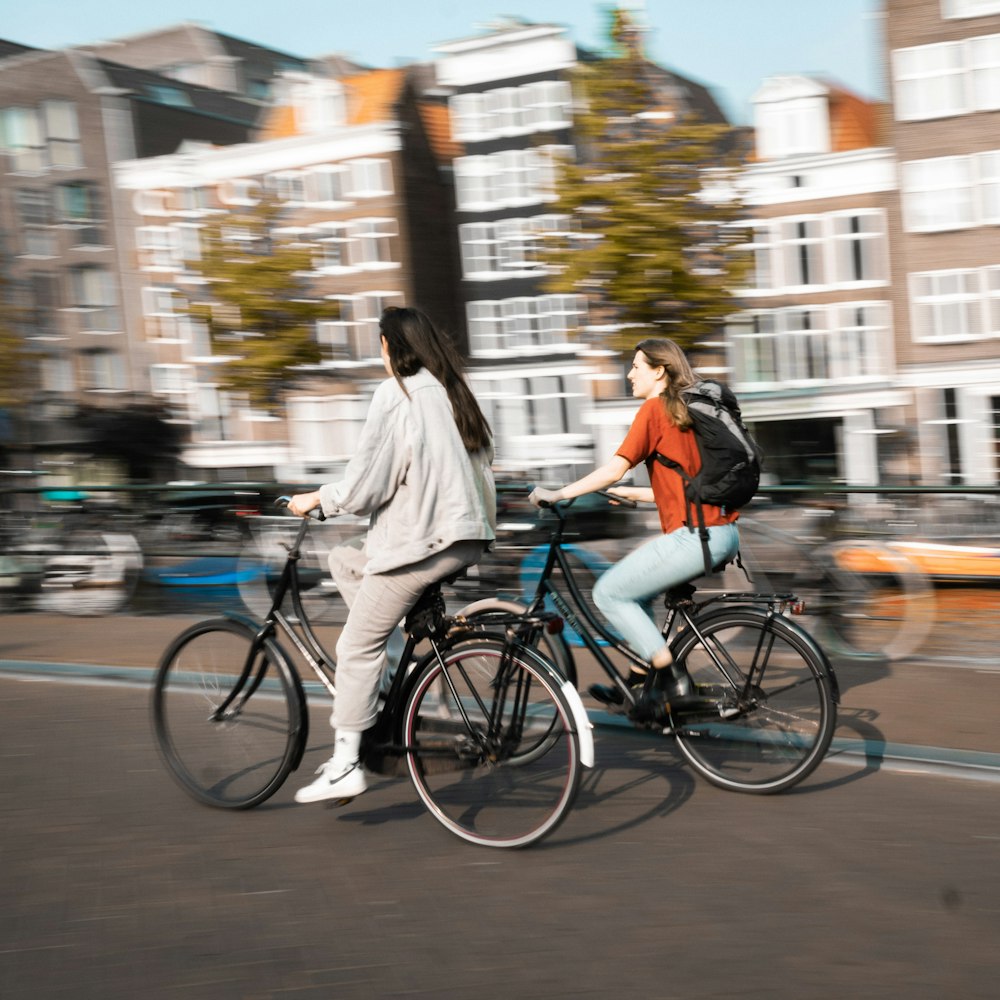 two women riding bicycles