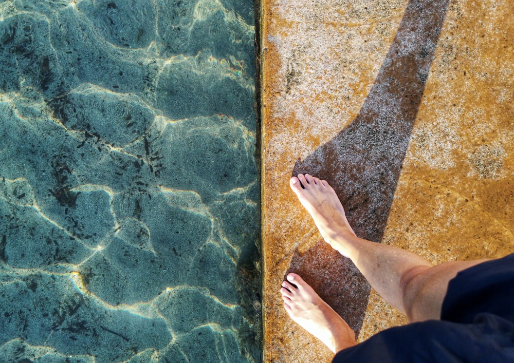 person standing near body of water