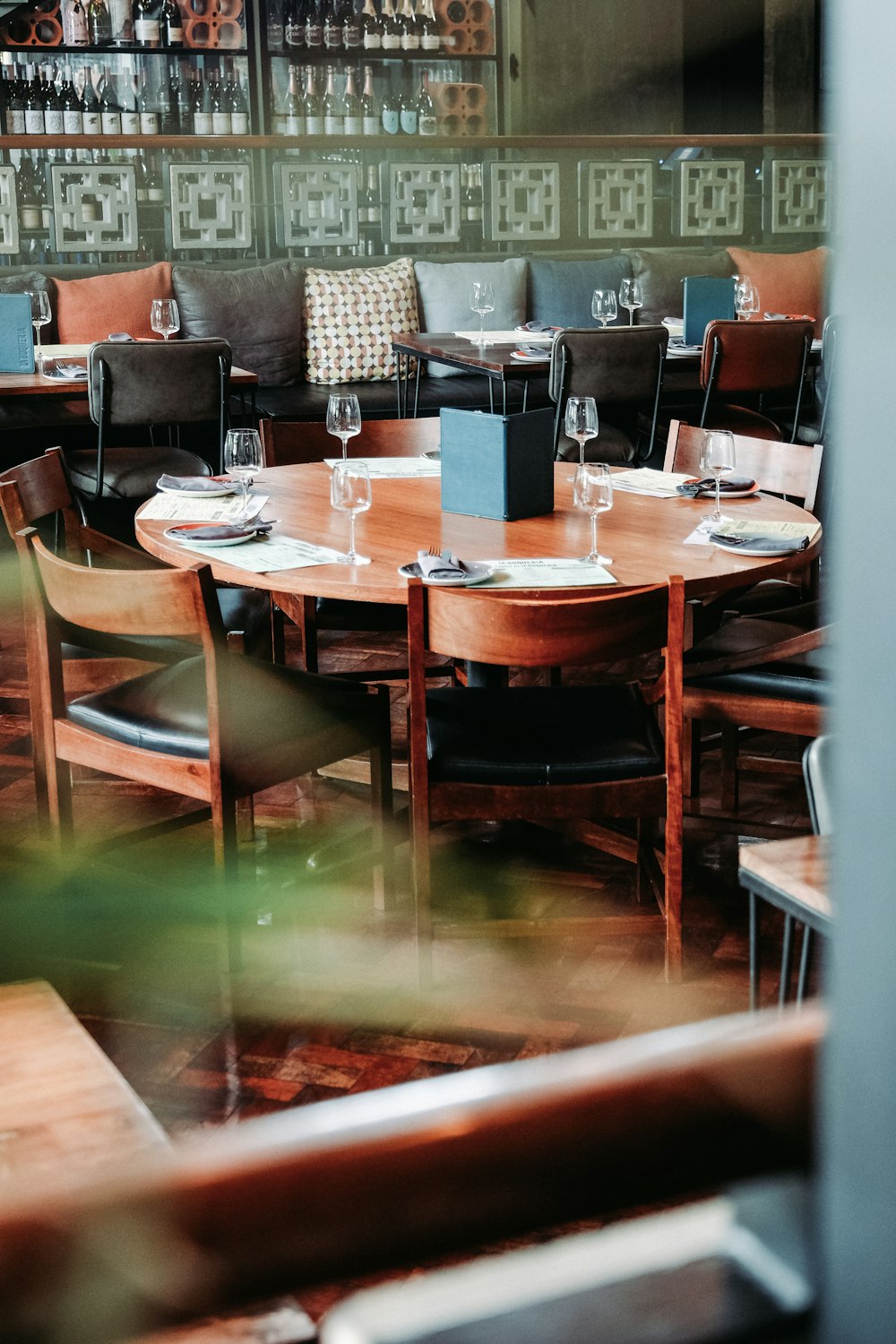 shallow focus photo of round brown wooden table