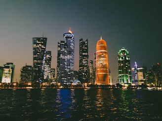 Nighttime cityscape of Quito with subtle orange and gray tones reflecting nightlife.
