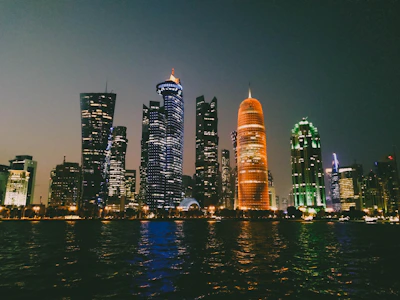 Nighttime cityscape of Quito with subtle orange and gray tones reflecting nightlife.