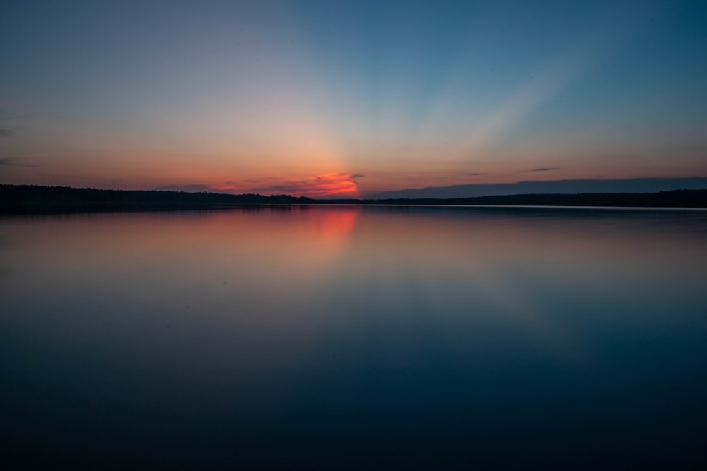 body of water during golden hour