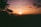 A scenic view of the Rhön mountains at sunset.