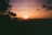 A scenic view of the Rhön mountains at sunset.