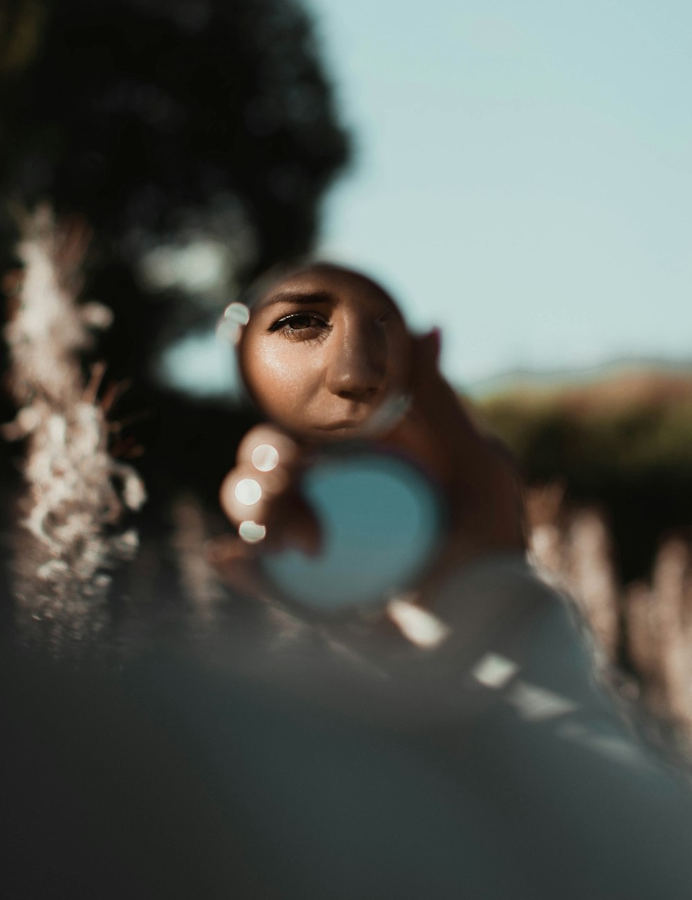 woman taking photo of mirror