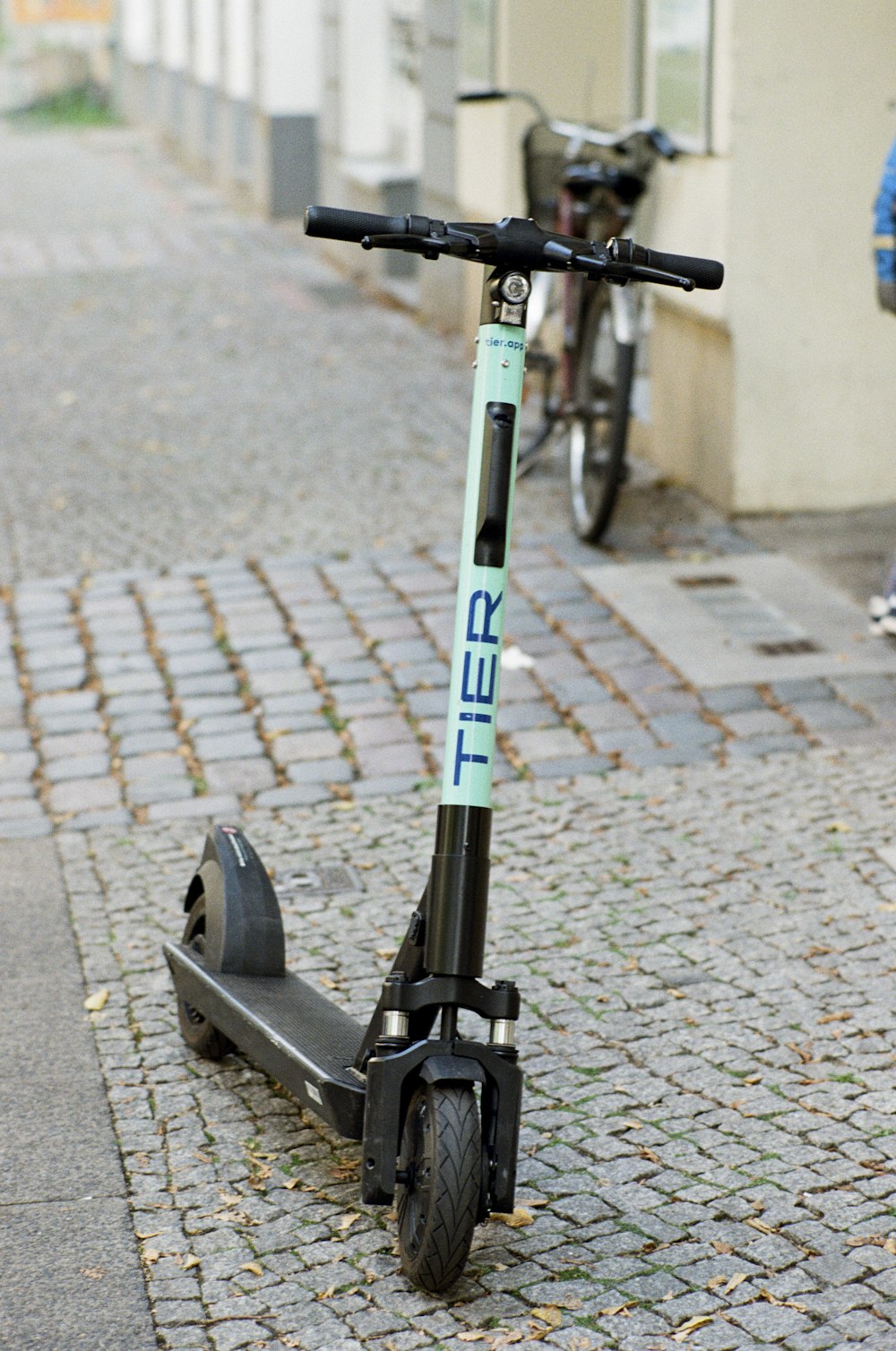 black and teal Tier kick scooter