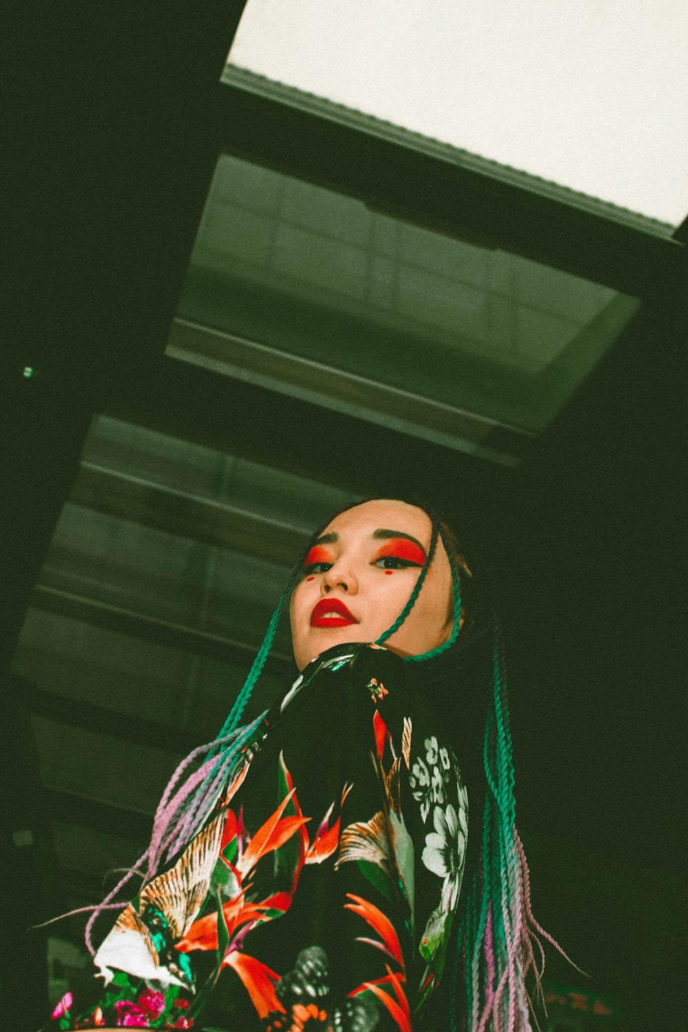 woman in black and red floral dress