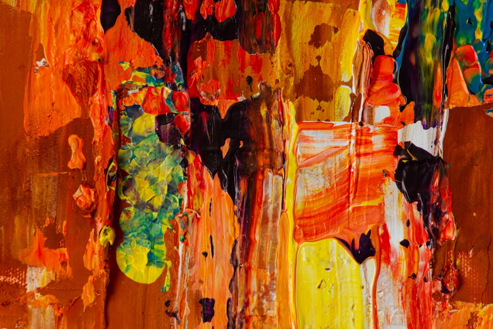 an abstract painting of oranges, yellows, and browns