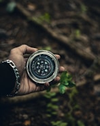person holding compass